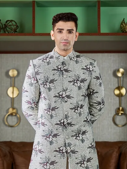 For a bold and artistic statement, I designed this floral printed Indo-Western jacket. The monochrome print is modern and eye-catching, perfect for a Mehendi or Sangeet.