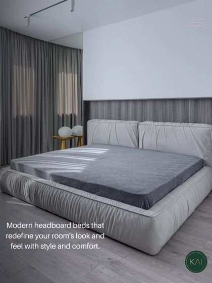This modern bed features a unique, plush, ruched-fabric frame and headboard in a soft grey. It’s designed to redefine the room's look with its blend of contemporary style and exceptional comfort.