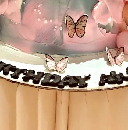 An identical shot of the cake's detailed decorations.