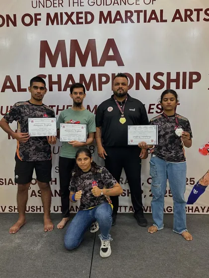 Divya with her silver medal at the FMMAI National MMA Championship. Losses don't define us, they shape us. Her grit and growth inspire everyone at the club.