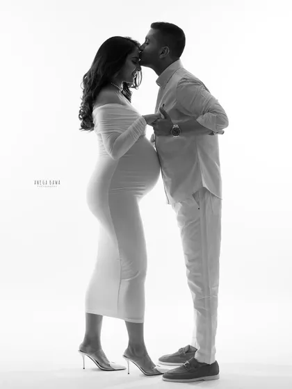 Sometimes, the most powerful emotions are found in silhouette. This black and white portrait focuses on the connection and quiet anticipation between a couple, creating a timeless and artistic memory of their journey together.