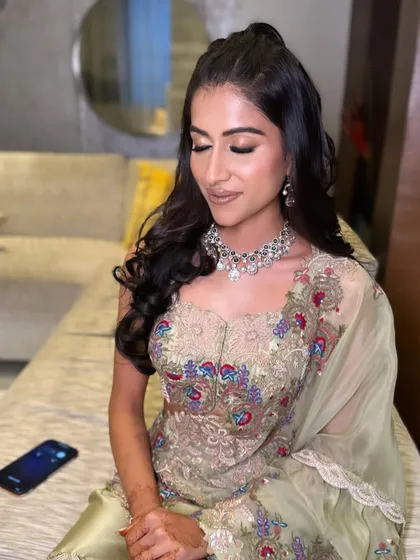 A close-up of the client's flawless makeup and hairstyle.
