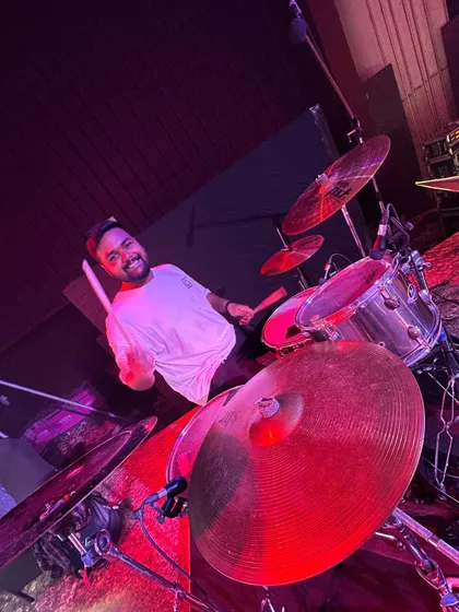 Our drummer, all smiles behind the kit. The joy we have playing together is something the audience can always feel.