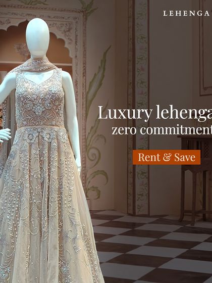 Luxury lehengas, zero commitment. This elegant Anarkali-style gown in a neutral tone with all-over silver embroidery is a timeless piece for any formal wedding function.