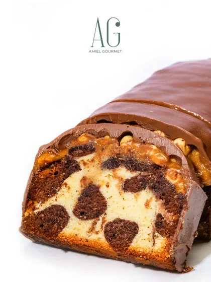 A closer look at the intricate swirls of my glazed marble cake. Each slice reveals a unique pattern of rich chocolate and soft vanilla cake, topped with a decadent chocolate and nut glaze.