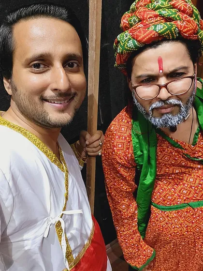 Two of our actors in character backstage. The transformation into a character involves detailed work on costume, makeup, and mannerisms.