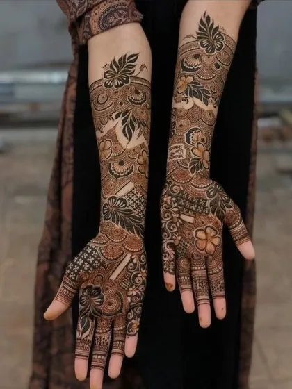 Here, I've blended traditional Indian motifs with bold floral work. The design extends up the arm, creating a statement piece that is both elegant and eye-catching.