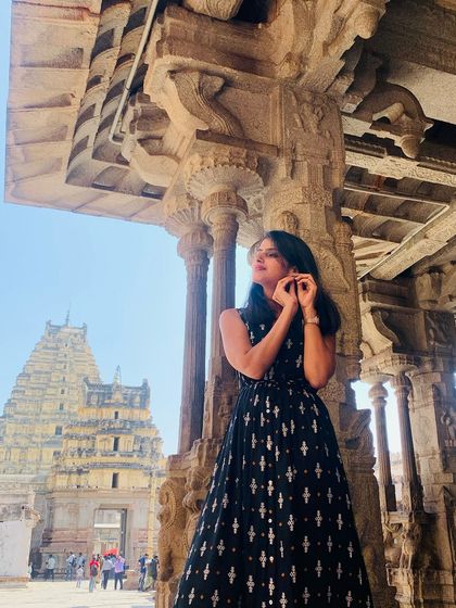 A close-up shot highlighting the detailed architecture of the temple pillars in Hampi.