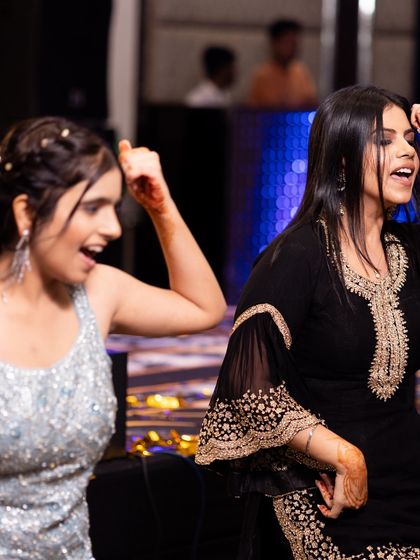 Two friends enjoying the dance. Our goal is to make the choreography so much fun that you can't help but smile.