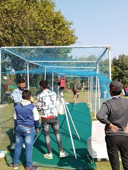 A full view of the cricket net and bowling machine setup, a unique rental item that always attracts a crowd.