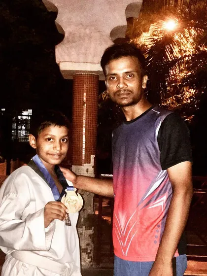 A moment of pride with another one of my medal-winning students. My goal is to guide each athlete to achieve their personal best.
