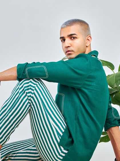 Another look at the emerald green shirt and striped trousers from the Antriksh collection. A perfect combination of classic patterns and modern design.