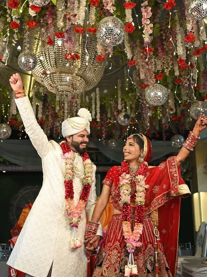 Pure celebration. This photo captures the energy of the wedding, with the bride looking absolutely radiant and her makeup perfectly intact.