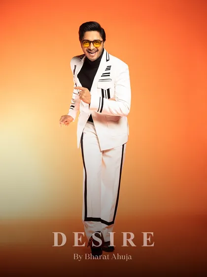Stepping into the spotlight with unstoppable charm. This white co-ord set with black stripes has a retro flair and a modern, tailored fit.