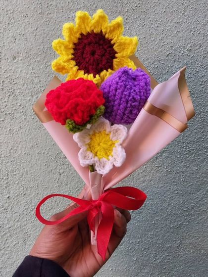 My mini flower bouquet, featuring a sunflower, carnation, tulip, and daisy. A perfect little bundle of joy for just ₹400.