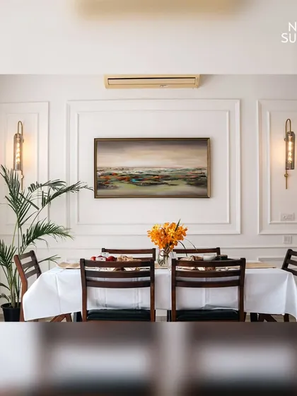 A well-designed dining area turns meals into memorable experiences. In this space, we used elegant wall mouldings, statement lighting, and curated artwork to create a bright, airy, and refined setting perfect for family dinners or entertaining guests.