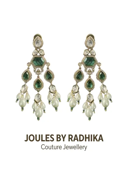 A pair of couture chandelier earrings, featuring emeralds and polki with cascading pearl drops. A perfect match for a grand bridal necklace.