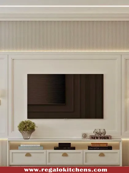 This classic, elegant TV unit features traditional molding and fluted panel details. The integrated wall sconces and soft backlighting create a cozy and sophisticated ambiance.