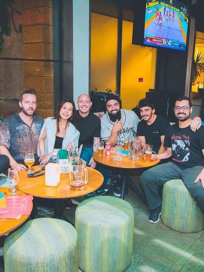 A group of friends relaxing at a table.