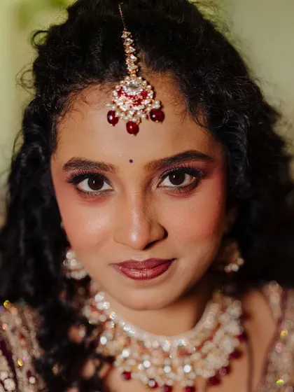 A close-up on the eye makeup for this reception look. The warm, shimmery tones make her eyes pop while still looking soft and romantic.