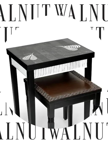 A modern take on the nesting table, this set combines a dark wood frame with unique textures. The larger table features hand-painted details and a fringed edge, while the smaller stool has a woven leather top.