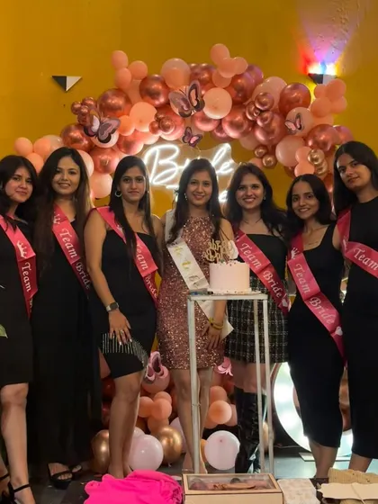 A great group shot of the 'Team Bride' with the bride-to-be. This backdrop makes everyone look great and feel festive.