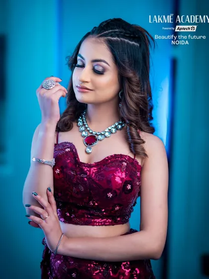 A full-length view of a modern party look. The braided hairstyle and shimmering makeup are perfect for a cocktail event or sangeet ceremony.