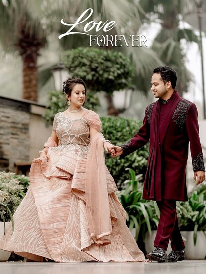 A romantic walking shot of the couple in a beautifully landscaped garden. The title "Love Forever" perfectly captures the timeless and elegant feel of this pre-wedding moment.