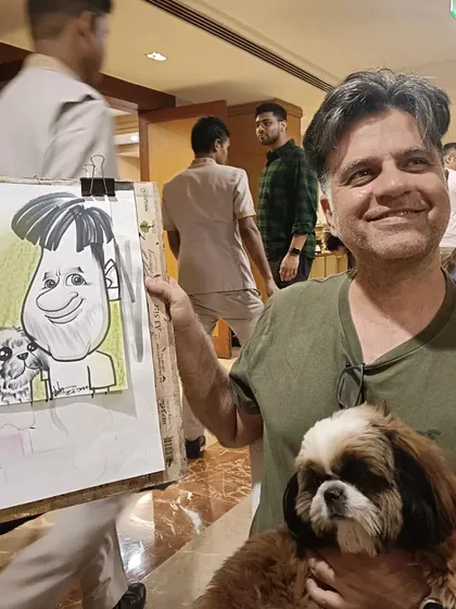 A guest and his adorable Shih Tzu with their portrait. It was a fantastic event for pet lovers.