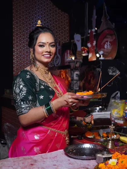 A radiant smile from a client dressed for Ganesh Utsav. The makeup is kept fresh and glowing, perfect for offering prayers and celebrating with family.