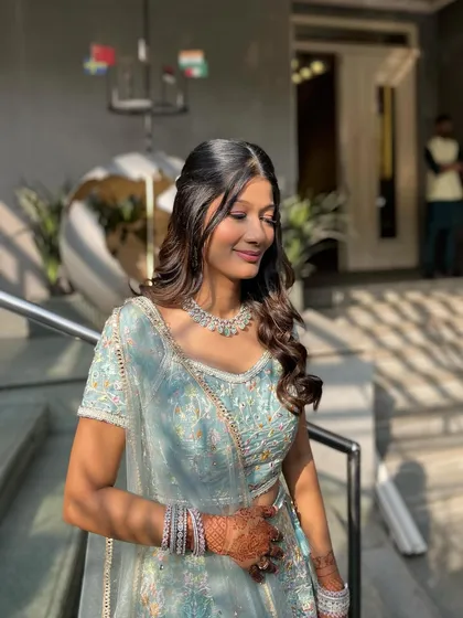 The sun-kissed glow of this engagement look. The natural light enhances the dewy finish of the makeup.