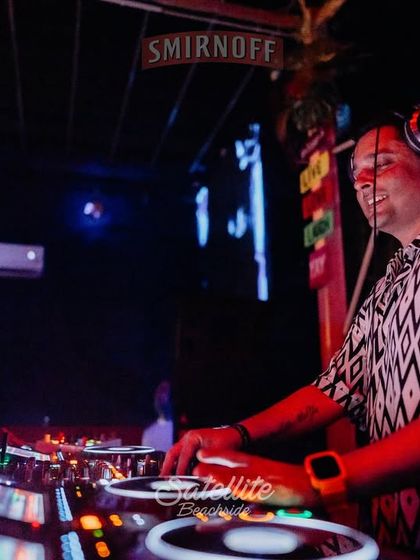 A smile behind the decks at Satellite Beachside. Enjoying the moment and the fantastic energy from the Goa crowd.