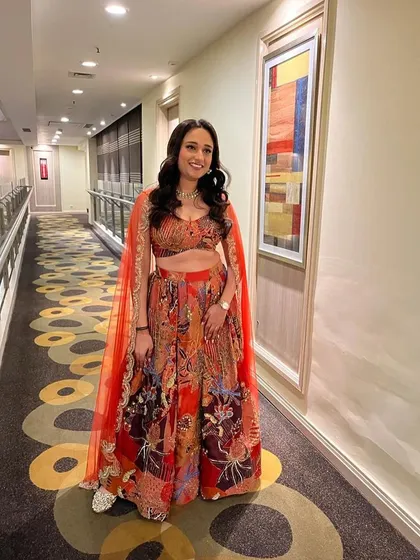 Another view of this gorgeous bridesmaid's lehenga. The intricate print and bold colors make it a perfect choice for a sangeet or mehendi ceremony.