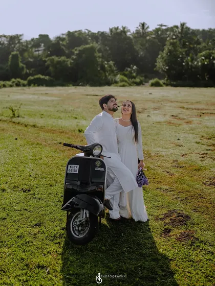 A fun and stylish pose with the scooter. This shot has a cool, editorial feel.