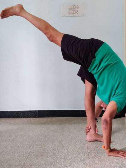 Eka Pada Uttanasana (Standing Split). This pose challenges balance while providing a deep stretch for the hamstring of the standing leg.