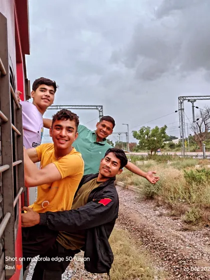 Some fun moments from our journey to the south. The boys are enjoying the view from the train door, a classic part of any Indian train adventure.