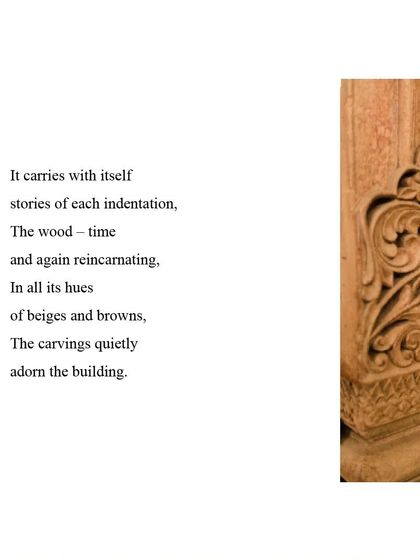 Wood carries stories in each indentation. This intricately carved detail from a piece of repurposed wood adds a layer of history and artistry to the building.