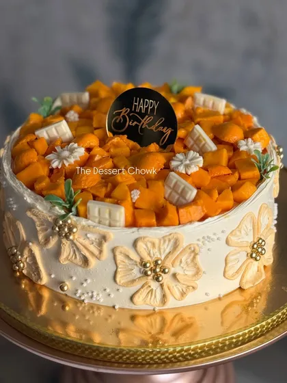 An elegant version of the Mango Maharaja cake with beautiful buttercream flower details on the side.
