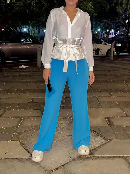 A straight-on view showing how a simple waist belt can transform a regular shirt and pants combo. This is a great trick for pear-shaped bodies to define the waist.