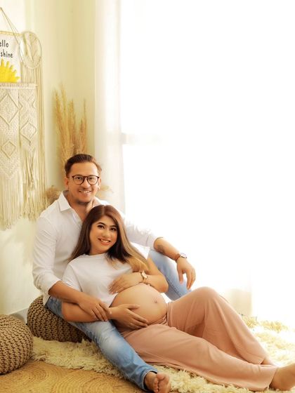 A relaxed and happy couple's portrait in our Boho setup. Their comfortable pose and genuine smiles make this a beautiful, natural shot.