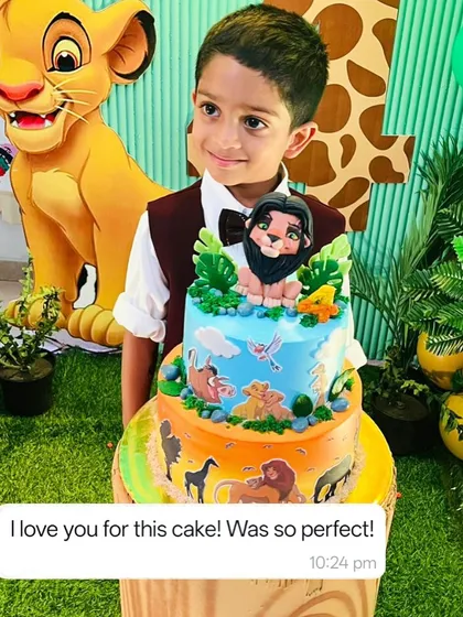 The birthday boy with his amazing two-tier Lion King cake. Seeing this smile is why I love what I do.