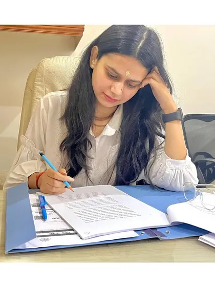 The real work of a lawyer often happens away from the courtroom. Here, I am meticulously reviewing case files and drafting documents, ensuring every detail is perfect before we proceed. My focus is on building a strong, unshakeable case for you.
