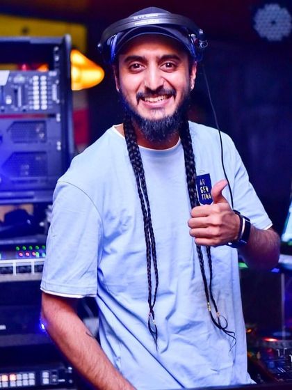 A festive thumbs-up to the camera. Wishing everyone a Merry Christmas from behind the decks.