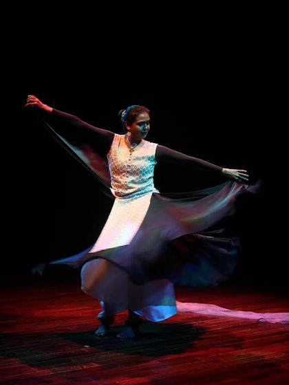 A dancer strikes a powerful pose during the Parabola of Dance showcase.