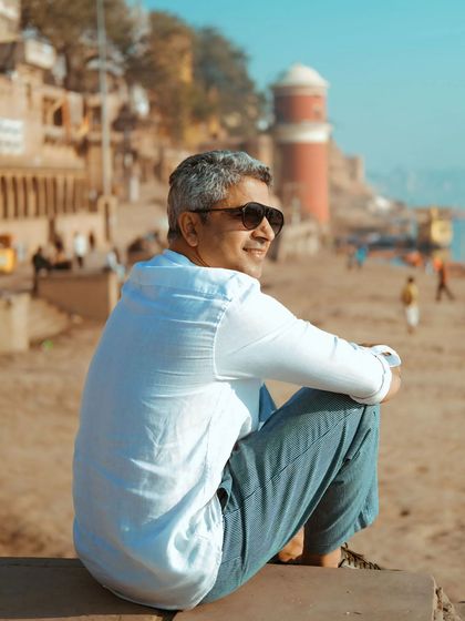 A moment of quiet contemplation by the Ganga. This portrait captures the serene experience of connecting with the soul of Banaras.