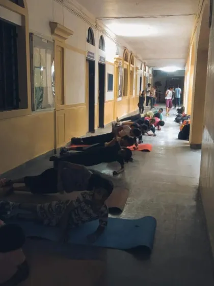 Core strength is vital for a fencer's stability and power. Here, our students are engaged in floor exercises like planks to build a strong physical foundation.