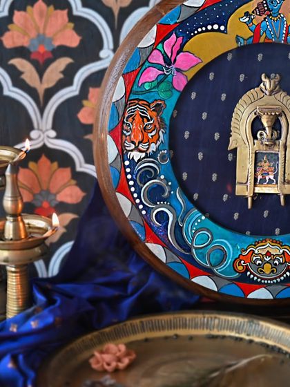 A detail shot of the Rahu frame, highlighting the hand-painted tiger. The piece is a powerful representation of the Asura born of a lioness, a key figure in the lore of celestial eclipses.