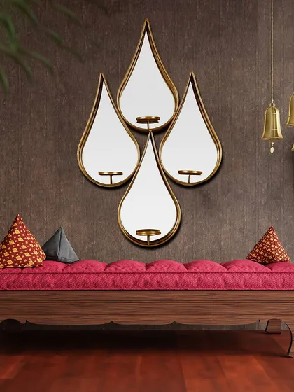 Transform your walls with this set of four cascading water droplet mirrors. The graceful curves and reflective surfaces add a sense of movement and elegance, and each mirror includes a small candle holder.