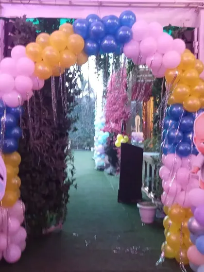 An entrance arch for a combined Boss Baby and Frozen party. This shows how I can merge two different themes to satisfy everyone, using character cutouts and colorful balloons.