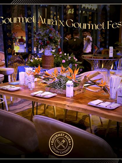 A long shot of the dining area at the Gourmet Fest, showing the collaboration and the scale of the event.